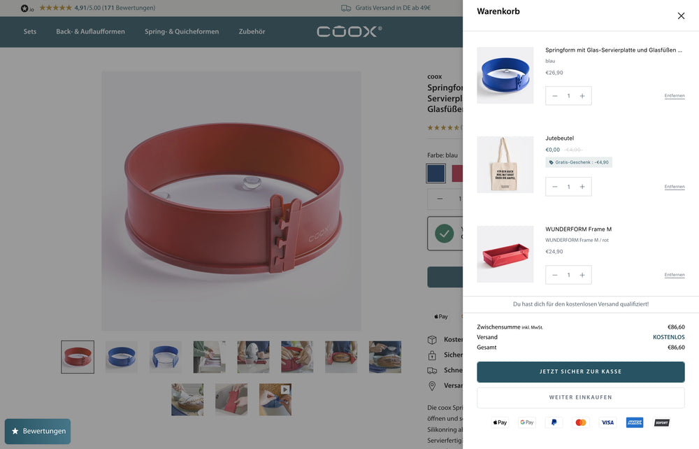 Roter Tortenring auf weißem Hintergrund, Einkaufswagen zeigt drei ausgewählte Artikel.