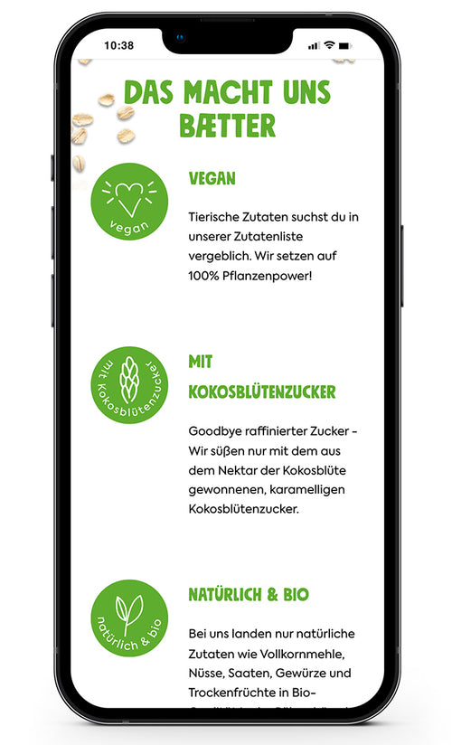Drei grüne Symbole zu vegan, Kokosblütenzucker, und biokost auf einem Smartphone-Bildschirm.