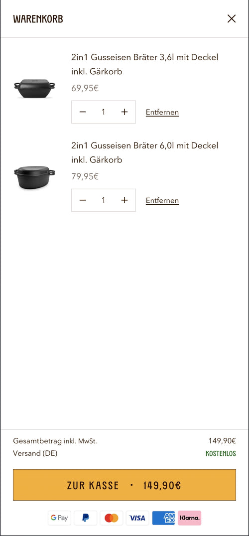 Einkaufswagen mit zwei Gusseisen-Brätern und Preis.